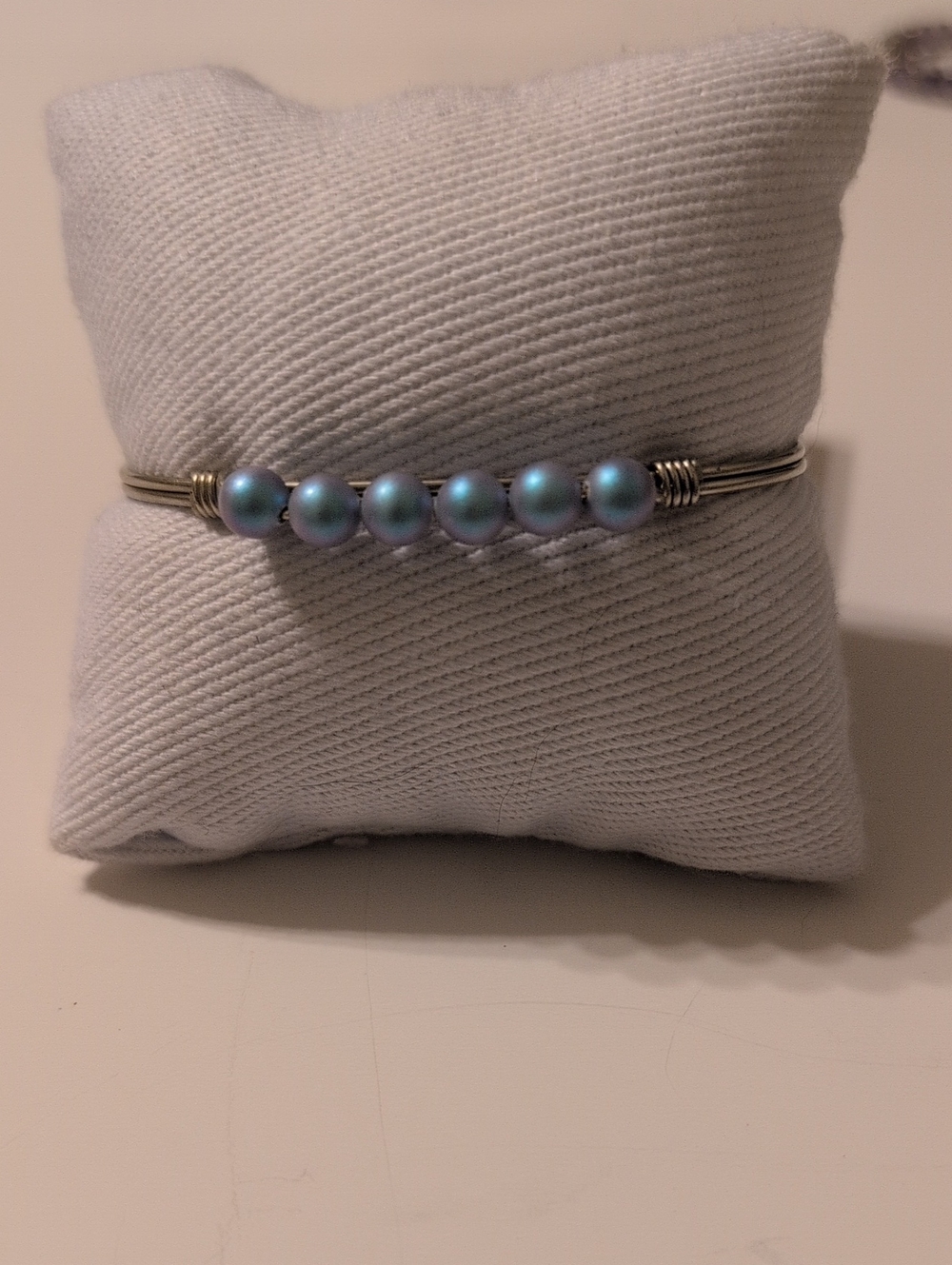 Luca And Danni Silver Wire Bracelet with Iridescent Light Blue Beads